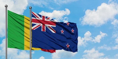 Mali and New Zealand flag waving in the wind against white cloudy blue sky together. Diplomacy...