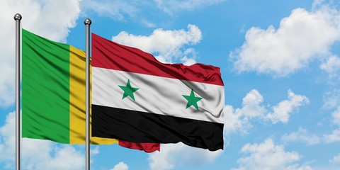 Mali and Syria flag waving in the wind against white cloudy blue sky together. Diplomacy concept,...