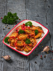 Freshly cooked sun-dried tomatoes on a bowl on a wooden table. Vegetarian food.