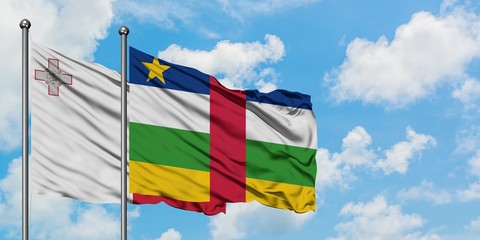 Malta and Central African Republic flag waving in the wind against white cloudy blue sky together. Diplomacy concept, international relations.