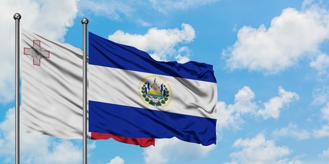 Malta and El Salvador flag waving in the wind against white cloudy blue sky together. Diplomacy concept, international relations.