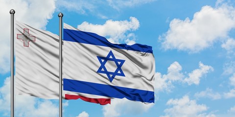 Malta and Israel flag waving in the wind against white cloudy blue sky together. Diplomacy concept, international relations.