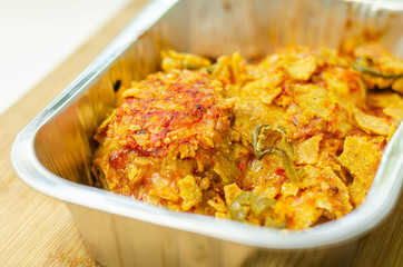 Chicken breast fillets with a chilli and cheese tomato sauce, Cheddar and chilli crushed nacho crumb and grated cheese