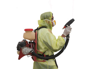 Doctor with ULV sprayer corona virus.Paramedic wearing yellow protective costume and mask...