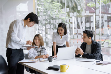 Female startup business coach giving recommendations, advise,explaining new idea to caucasian employee at meeting. Startup business, cooperation, workshop concept.