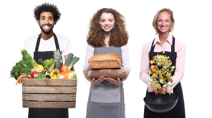 man and woman with fruit and vegetables in front of a white background