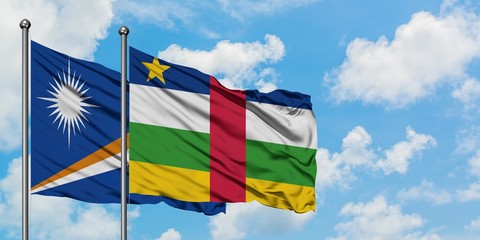 Marshall Islands and Central African Republic flag waving in the wind against white cloudy blue sky together. Diplomacy concept, international relations.