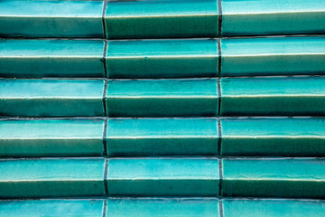 Detail of jade green colour ceramic tiles in Sukhothai, Thailand