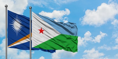 Marshall Islands and Djibouti flag waving in the wind against white cloudy blue sky together. Diplomacy concept, international relations.