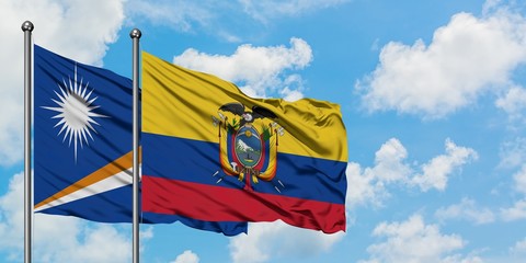 Marshall Islands and Ecuador flag waving in the wind against white cloudy blue sky together. Diplomacy concept, international relations.