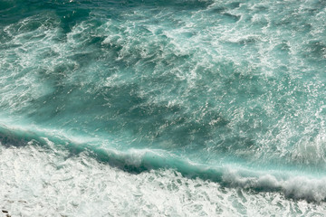 Fototapeta na wymiar Waves Breaking on the Shore