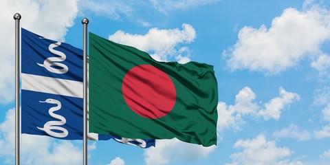 Martinique and Bangladesh flag waving in the wind against white cloudy blue sky together. Diplomacy concept, international relations.