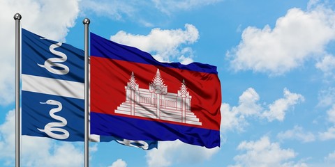 Martinique and Cambodia flag waving in the wind against white cloudy blue sky together. Diplomacy concept, international relations.