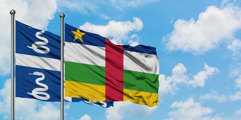 Martinique and Central African Republic flag waving in the wind against white cloudy blue sky together. Diplomacy concept, international relations.