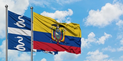 Martinique and Ecuador flag waving in the wind against white cloudy blue sky together. Diplomacy concept, international relations.