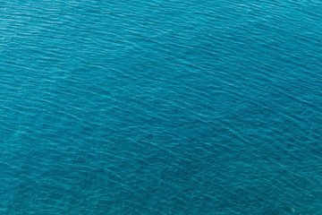 Fototapeta na wymiar Blue sea surface with waves aerial view