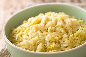 Fresh homemade braised white cabbage in bowl (Selective Focus, Focus one third into the cabbage)