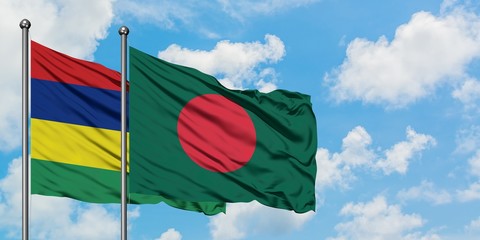 Mauritius and Bangladesh flag waving in the wind against white cloudy blue sky together. Diplomacy concept, international relations.