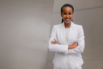 Smiling cheerful headshot portrait of an african businesswoman, corporate executive, business career professional in swanky stylish suit - 301051601