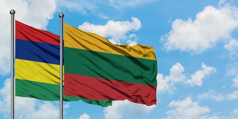 Mauritius and Lithuania flag waving in the wind against white cloudy blue sky together. Diplomacy concept, international relations.