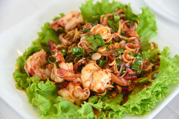 spicy salad with pork and shellfish and Vegetable on the table in a restaurant