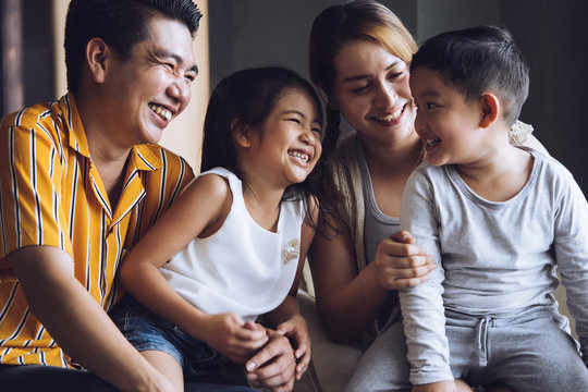 Happy Family With Kids Spending Time Together At Home.