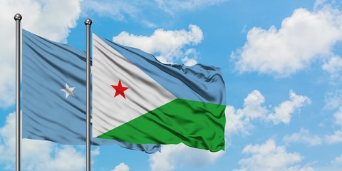Micronesia and Djibouti flag waving in the wind against white cloudy blue sky together. Diplomacy...