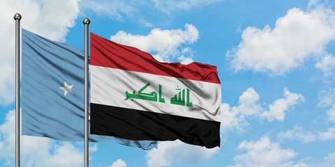 Micronesia and Iraq flag waving in the wind against white cloudy blue sky together. Diplomacy concept, international relations.