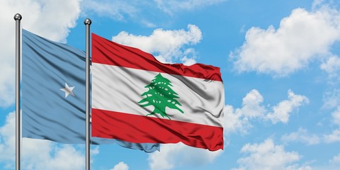 Micronesia and Lebanon flag waving in the wind against white cloudy blue sky together. Diplomacy concept, international relations.