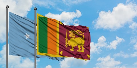 Micronesia and Sri Lanka flag waving in the wind against white cloudy blue sky together. Diplomacy concept, international relations.