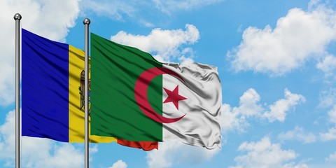 Moldova and Algeria flag waving in the wind against white cloudy blue sky together. Diplomacy...