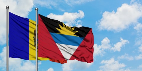 Moldova and Antigua and Barbuda flag waving in the wind against white cloudy blue sky together. Diplomacy concept, international relations.