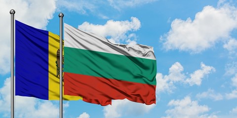 Moldova and Bulgaria flag waving in the wind against white cloudy blue sky together. Diplomacy concept, international relations.