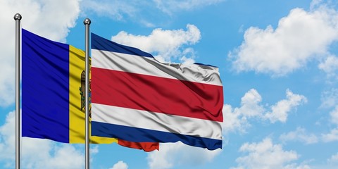 Moldova and Costa Rica flag waving in the wind against white cloudy blue sky together. Diplomacy concept, international relations.