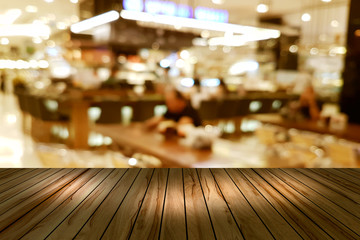 Top desk with blur restaurant background,wooden table