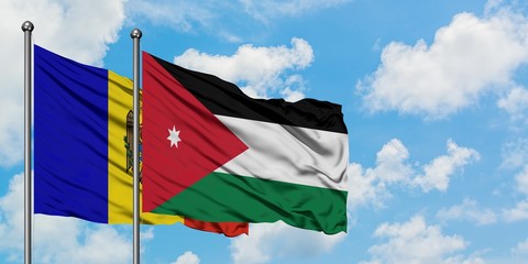 Moldova and Jordan flag waving in the wind against white cloudy blue sky together. Diplomacy concept, international relations.