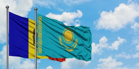Moldova and Kazakhstan flag waving in the wind against white cloudy blue sky together. Diplomacy concept, international relations.