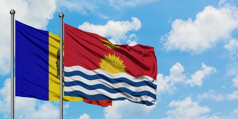 Moldova and Kiribati flag waving in the wind against white cloudy blue sky together. Diplomacy concept, international relations.