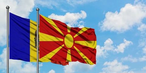 Moldova and Macedonia flag waving in the wind against white cloudy blue sky together. Diplomacy concept, international relations.