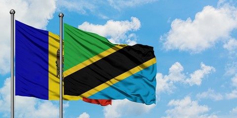 Moldova and Tanzania flag waving in the wind against white cloudy blue sky together. Diplomacy concept, international relations.