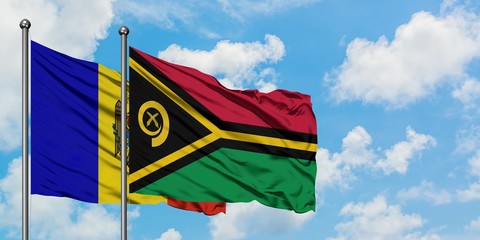 Moldova and Vanuatu flag waving in the wind against white cloudy blue sky together. Diplomacy concept, international relations.