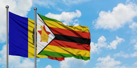 Moldova and Zimbabwe flag waving in the wind against white cloudy blue sky together. Diplomacy concept, international relations.