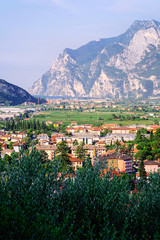 Fototapeta na wymiar Aerial view and Landscape in Arco town at rock at Sarca Valley near Garda lake of Trentino in Italy. Scenery with cityscape and mountain at Arco old city in Trento near Riva del Garda. Outdoor