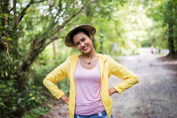 Portrait of young beautiful asian woman happy and smiling while standing at nature,Travel at outdoor