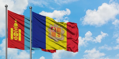 Mongolia and Andorra flag waving in the wind against white cloudy blue sky together. Diplomacy concept, international relations.