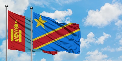 Mongolia and Congo flag waving in the wind against white cloudy blue sky together. Diplomacy concept, international relations.