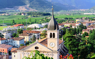 Landscape with Church Santa Maria Assunta on rock at Sarca Valley near Garda lake of Trentino in Italy. Scenery with Cathedral on mountain in Arco town in Trento near Riva del Garda