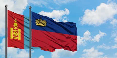 Mongolia and Liechtenstein flag waving in the wind against white cloudy blue sky together. Diplomacy concept, international relations.