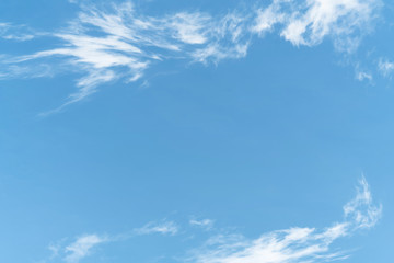 White cloud and blue sky background with copy space