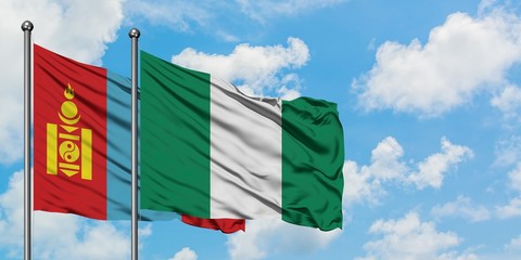Mongolia and Nigeria flag waving in the wind against white cloudy blue sky together. Diplomacy concept, international relations.